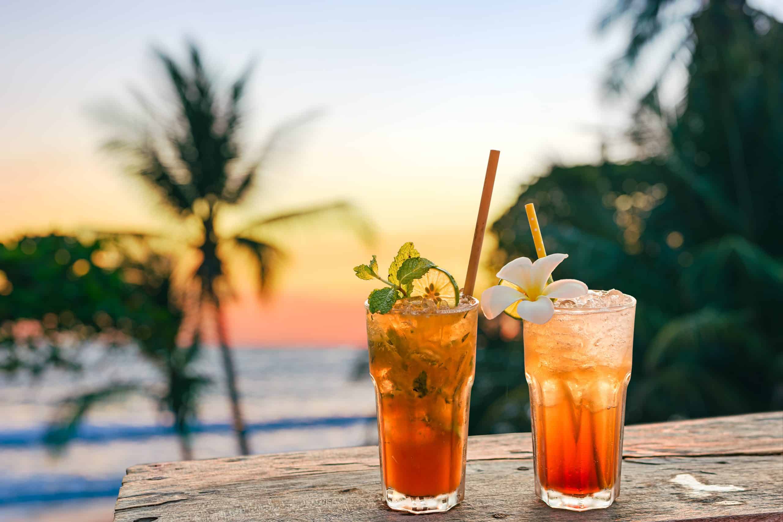 Drinks,With,Blur,Beach,And,Sunset,In,Background